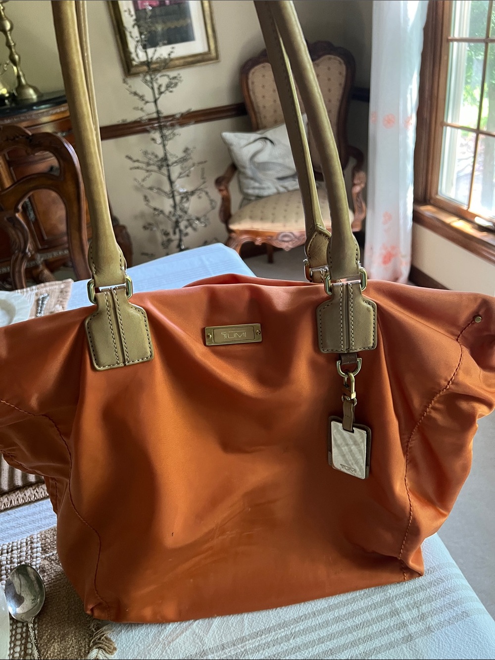 Tumi Orange Nylon Tote with Tan Leather Handles. Pre owned.